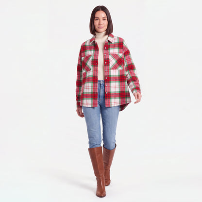 Woman walking in the Red Plaid flannel shacket worn open over a turtleneck