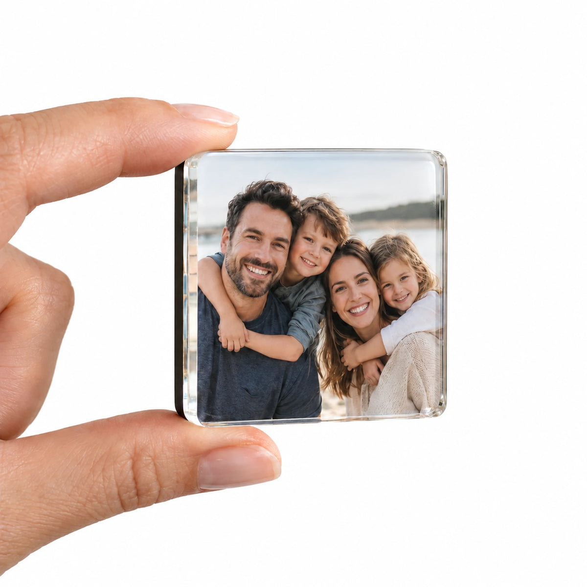 Magny finished photo magnet held between two fingers